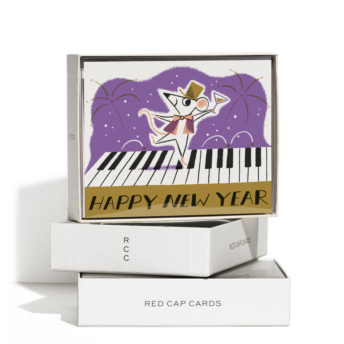 Boxed set of 8 Greeting cards with retro illustrated mouse dancing on piano keys with fireworks and 'Happy New Year' text.