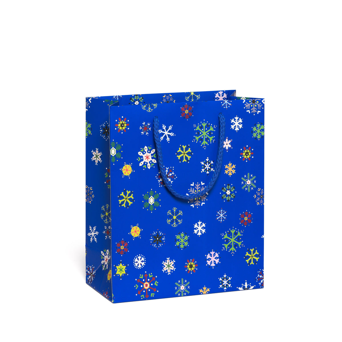 Blue gift bag with colorful snowflake pattern on a white background.