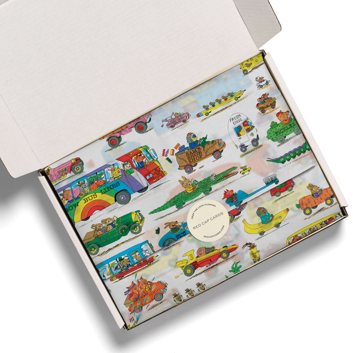 Busytown Cars designed tissue paper in festive white box on a white background.
